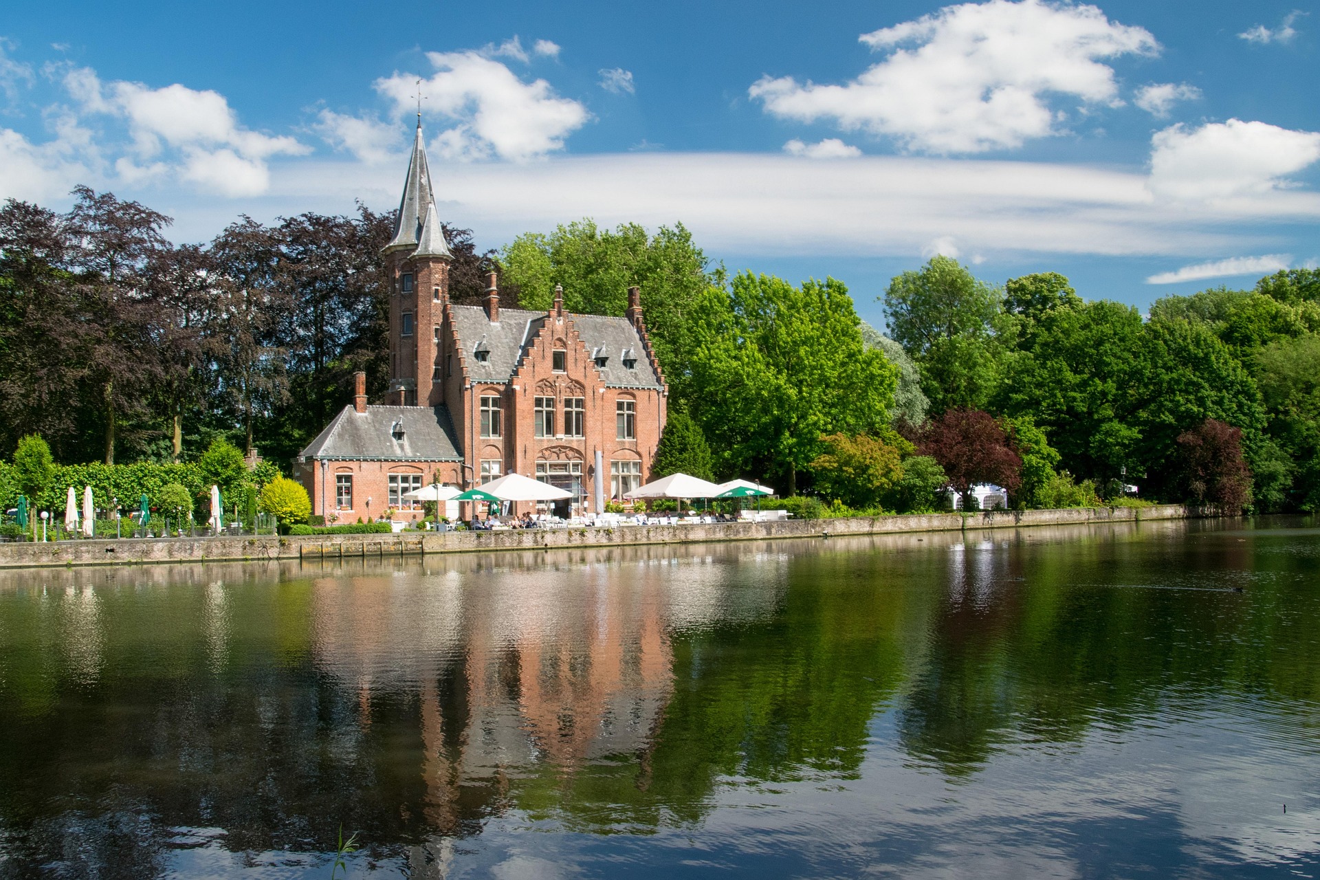 Minnewater Lake with swans in Bruges, the Lake of Love
